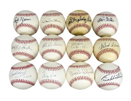 Lot of 12 Single-Signed Baseballs by Hall of Famers including Hank Aaron and Whitey Ford. 